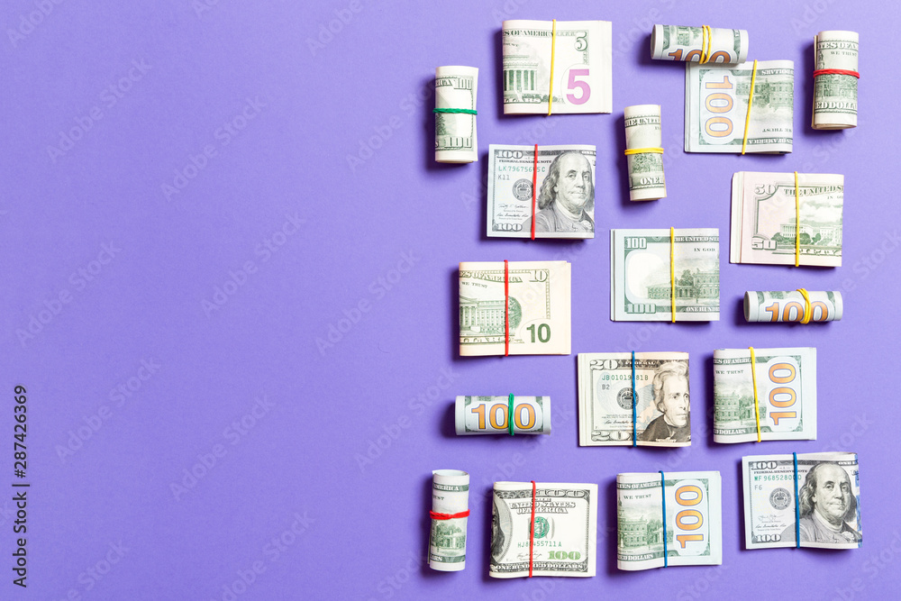 Dollar bills. Pile of one hundred US Dollar Bills money on colored background top wiev with copy space for your text in business concept Dollar bills. Pile of one hundred US Dollar Bills money on colored background top wiev with copy space for your text in business concept