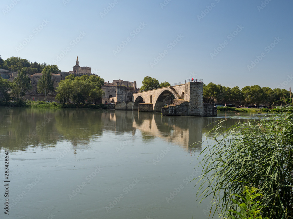 France, july 2019: Saint Benezet bridge and Palace of the Popes in Avignon in a beautiful summer day