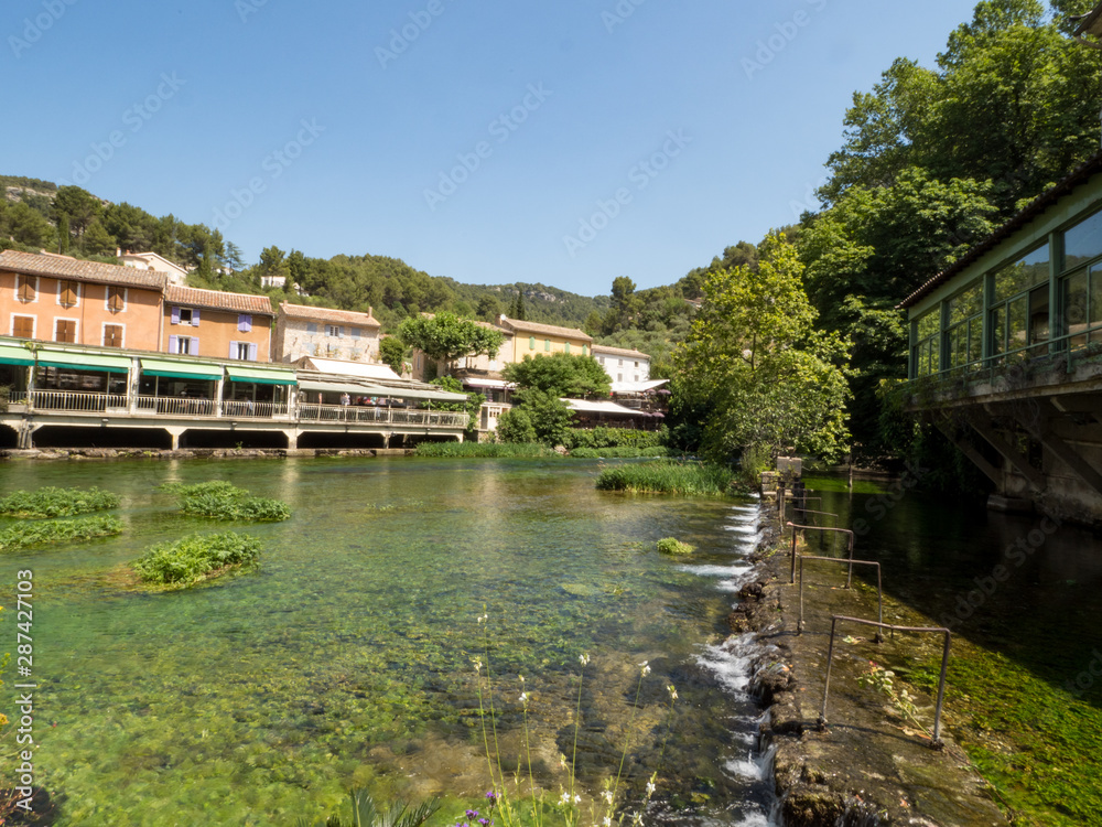 France, july 2019: Fontaine-de-Vaucluse, a small typical town in Provence. Beautiful village, with view on roof and landscape, small cafe and restaurants.