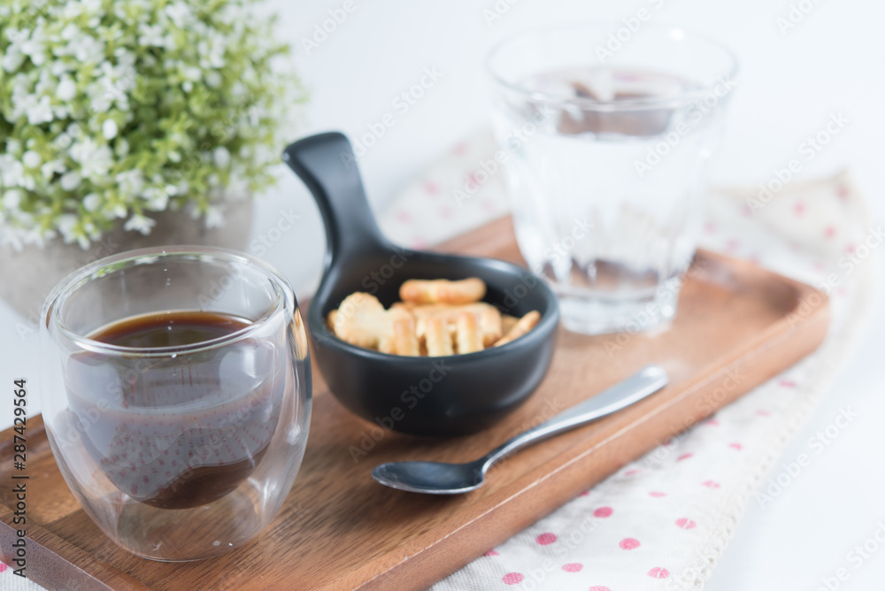 Cup of coffee with biscuits and water Cup of coffee with biscuits and water