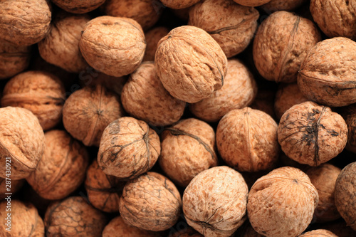 Fresh walnuts in shell background