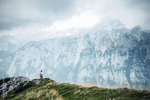 people in mountains, background alps, wonderful travel concept, space for text, atmospheric epic moment © sztnknmi