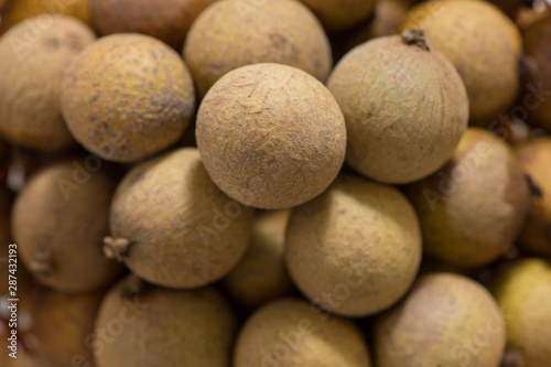 Fresh longan in Bamboo bowl isolated