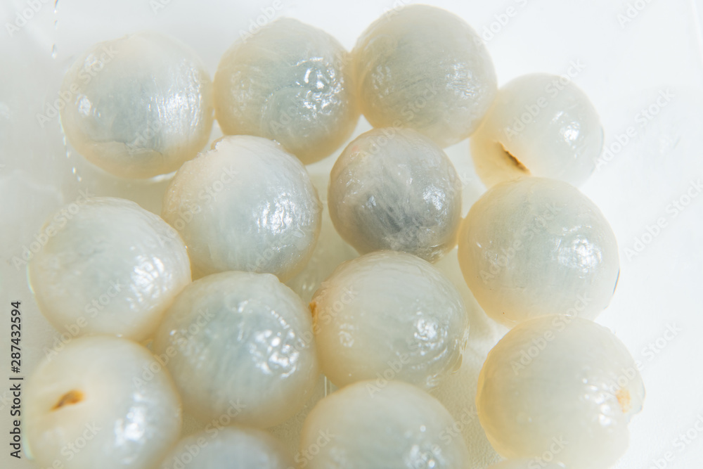 Peeled longan in a glass bowl isolated Peeled longan in a glass bowl isolated