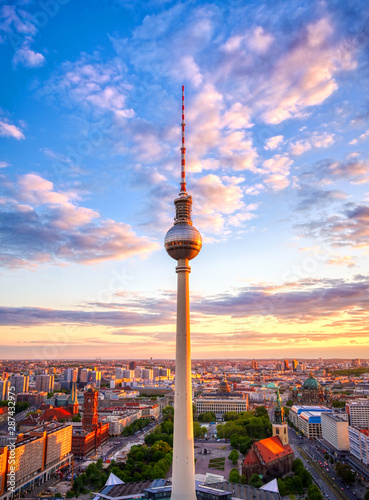 A view of the television tower  Fernsehturm  over the city of Berlin  Germany at sunset.