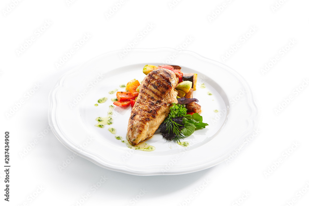 Macro Shot of Grilled Chicken Fillet with Side Dish of Baked Vegetables Macro Shot of Grilled Chicken Fillet with Side Dish of Baked Vegetables