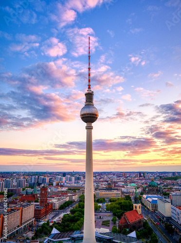 A view of the television tower (Fernsehturm) over the city of Berlin, Germany at sunset.