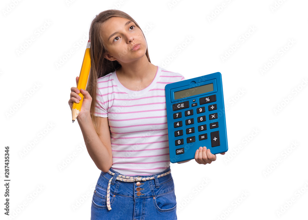 Thoughtful student holding big calculator and pencil. Portrait of funny cute teen girl, isolated on white background. Unhappy dreaming child Back to school. Thoughtful student holding big calculator and pencil. Portrait of funny cute teen girl, isolated on white background. Unhappy dreaming child Back to school.
