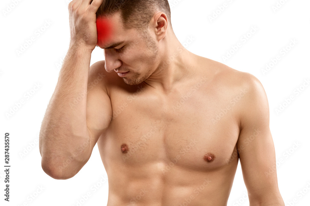 Shirtless stressed man having headache Shirtless stressed man having headache