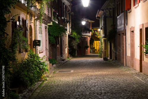 Fototapeta Naklejka Na Ścianę i Meble -  Beautiful colorful  street of medieval village Kaysersberg at night. Alsace. France.