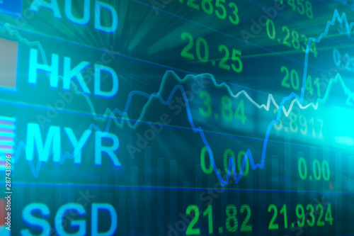 Abstract blurred of Currency exchange rate with graph chart line with volume bar on LED Monitor, Double exposure of currency exchange concept