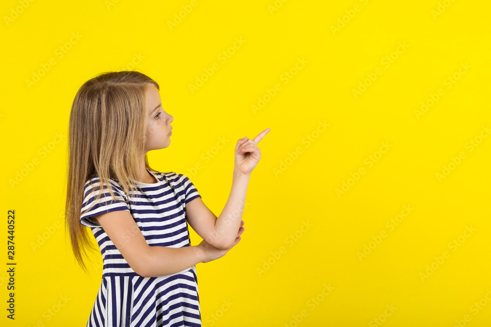 Beautiful little girl on yellow background Beautiful little girl on yellow background