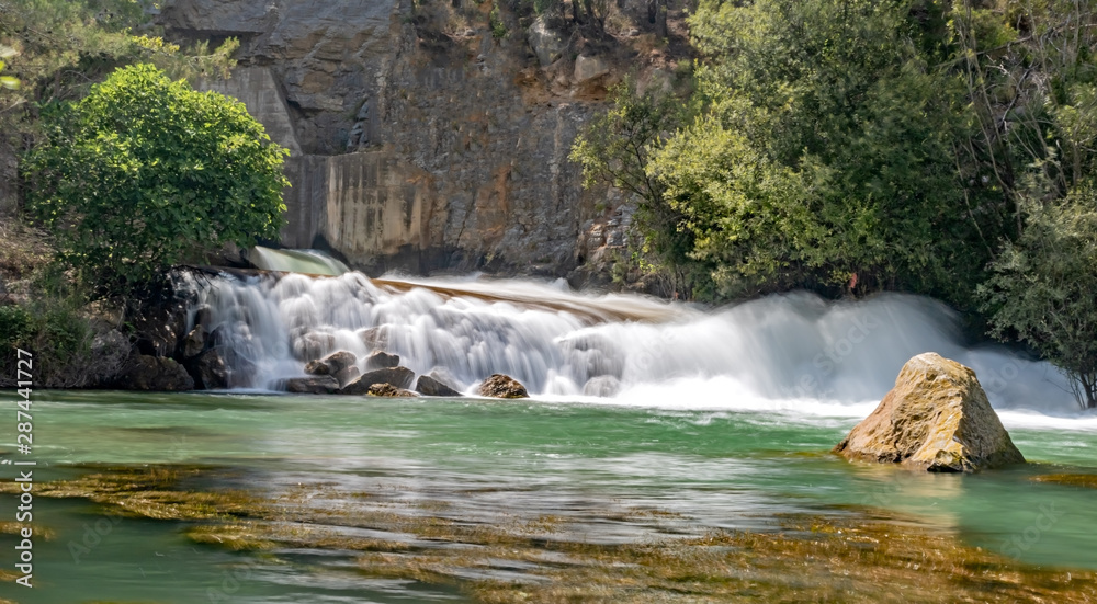 Naklejka premium Small waterfall on the Mijares river in long exposure