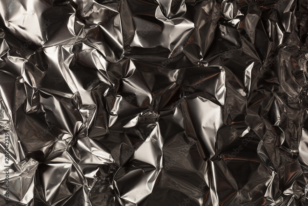 Full frame take of a sheeT of crumpled silver aluminum foil Full frame take of a sheeT of crumpled silver aluminum foil