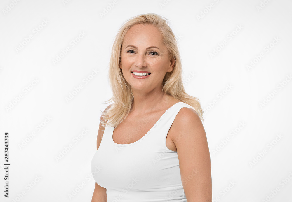 Portrait of beautiful mature woman with perfect skin on white background Portrait of beautiful mature woman with perfect skin on white background