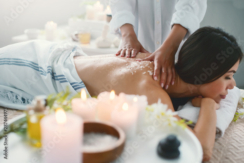 Woman relaxing with a massage in a spa center