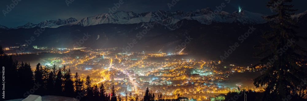 Aerial panorama of Zakopane and Tatry mountains at night