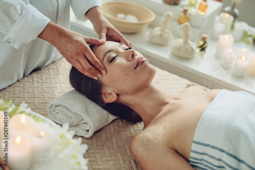 Woman relaxing with a massage in a spa center