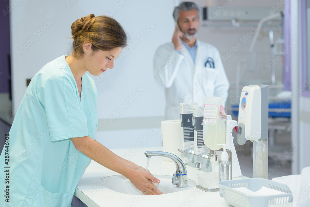 a medical staff washing hands a medical staff washing hands
