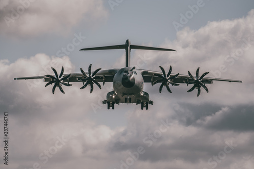 Photography large RAF Airbus A400 M Atlas transport plane flying head on to camera