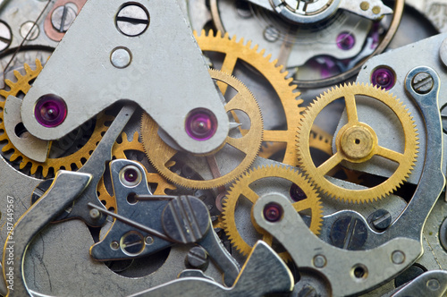 Clockwork, gears in an old watch. Teamwork concept, idea, technology, eternity, business. Macro