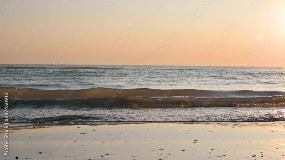 Dawn on the seashore. Sunlight and skyline. The morning rays of the sun. Selective focus in the frame. Dawn on the seashore. Sunlight and skyline. The morning rays of the sun. Selective focus in the frame.
