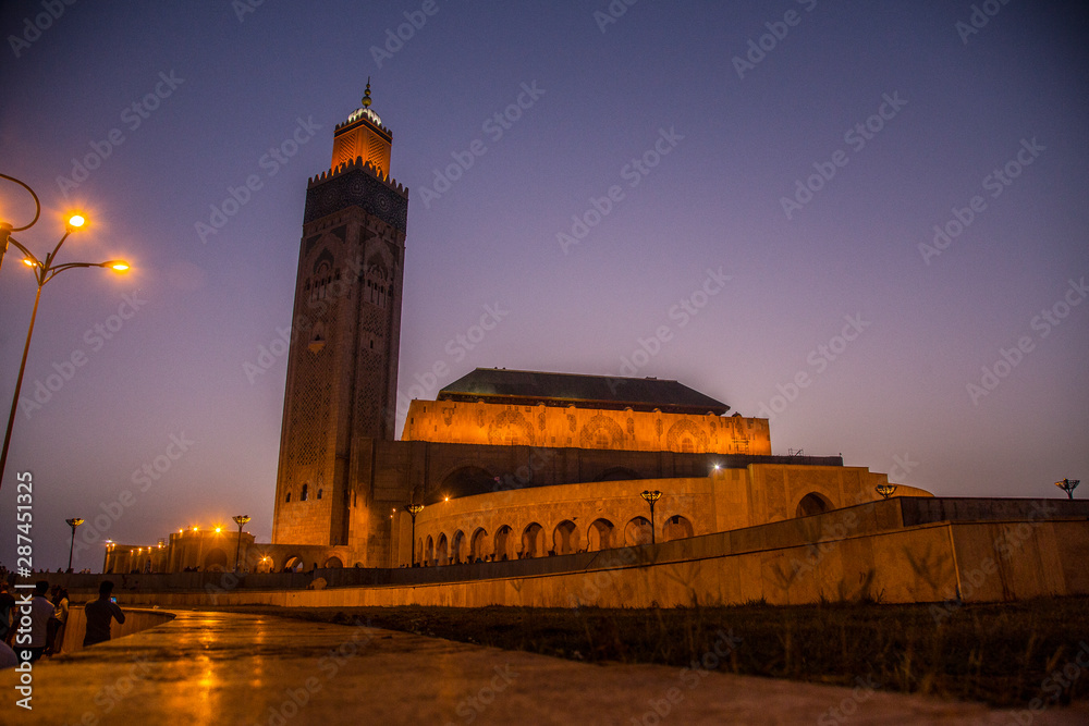 Sunset with the illuminated mosque in Hassan II Mosque of Casablanca. Morocco