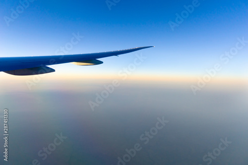 Traveling by air transport plane wing