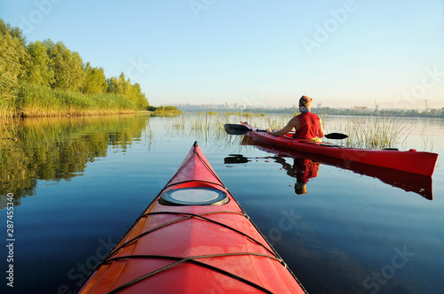 Two people kayaking on the river