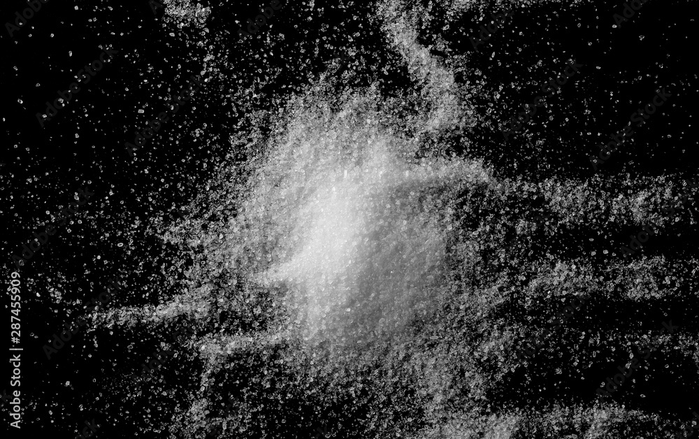 Obraz premium Pile sea salt grains crystals isolated on black background and texture, top view