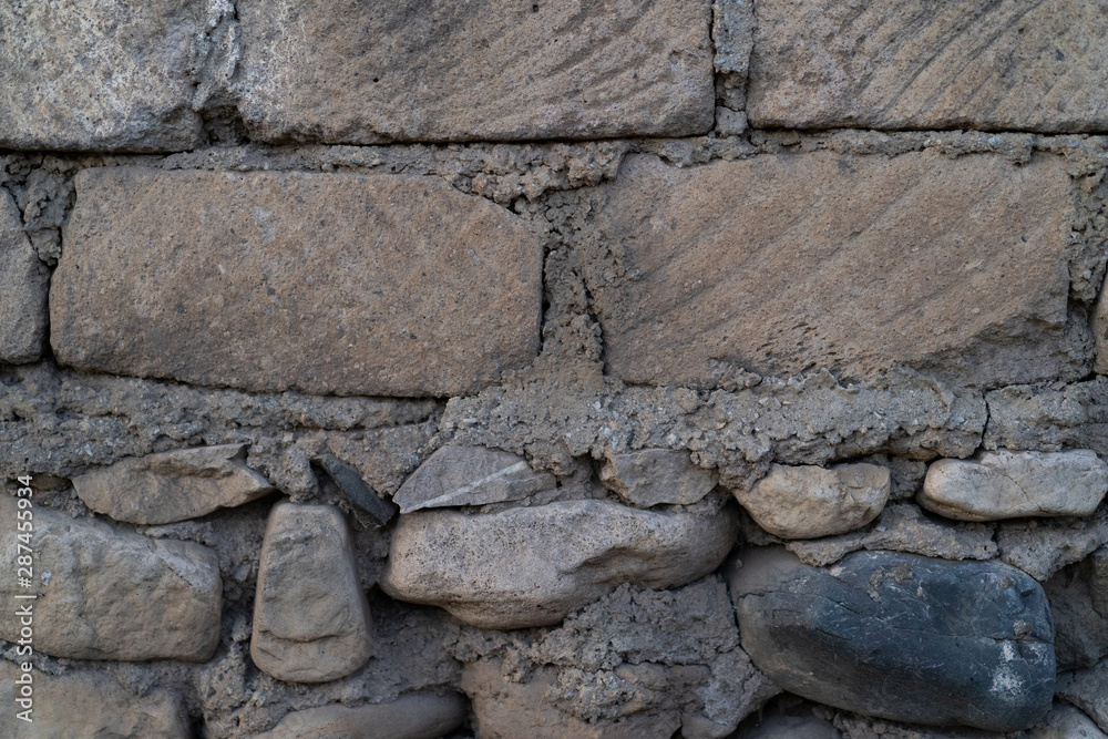 Naklejka premium Wall of stone as texture and background