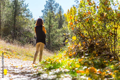A young girl on the beautiful path of the Hoces del Duraton natural park in Segovia, Spain