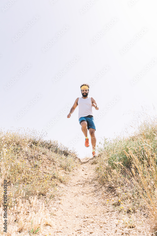 Man running up the mountain and jumping. Man running up the mountain and jumping.