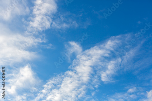 Blue sky with clouds background.Sky daylight. Natural sky composition. Element of design. © kanpisut