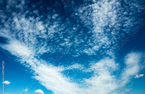 Beautiful blue sky with translucent, white, feathery clouds © Олеся Касумова