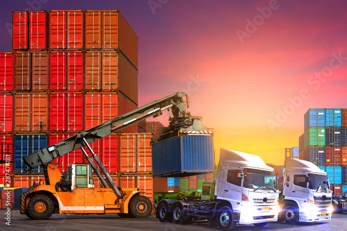 Industrial logistics and transportation of truck in Container yard for logistic and Cargo business plane.-image