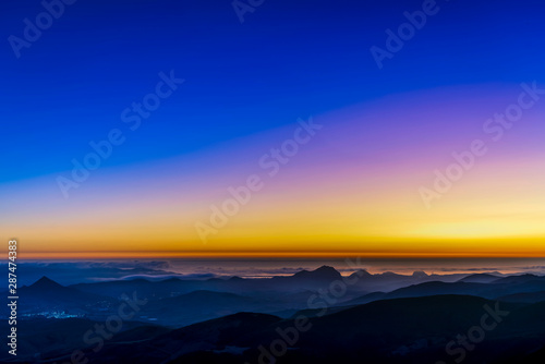 Dusk over Ocean, Silhouetted Hills © Mark
