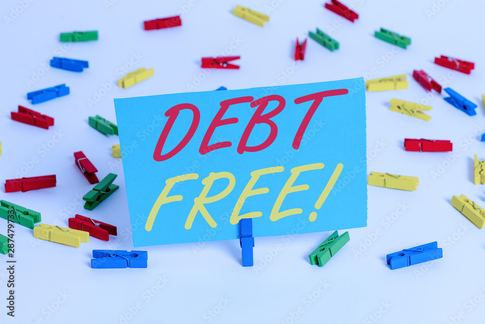 Text sign showing Debt Free. Business photo text does not owning any money or things to any individual or companies Colored clothespin papers empty reminder white floor background office