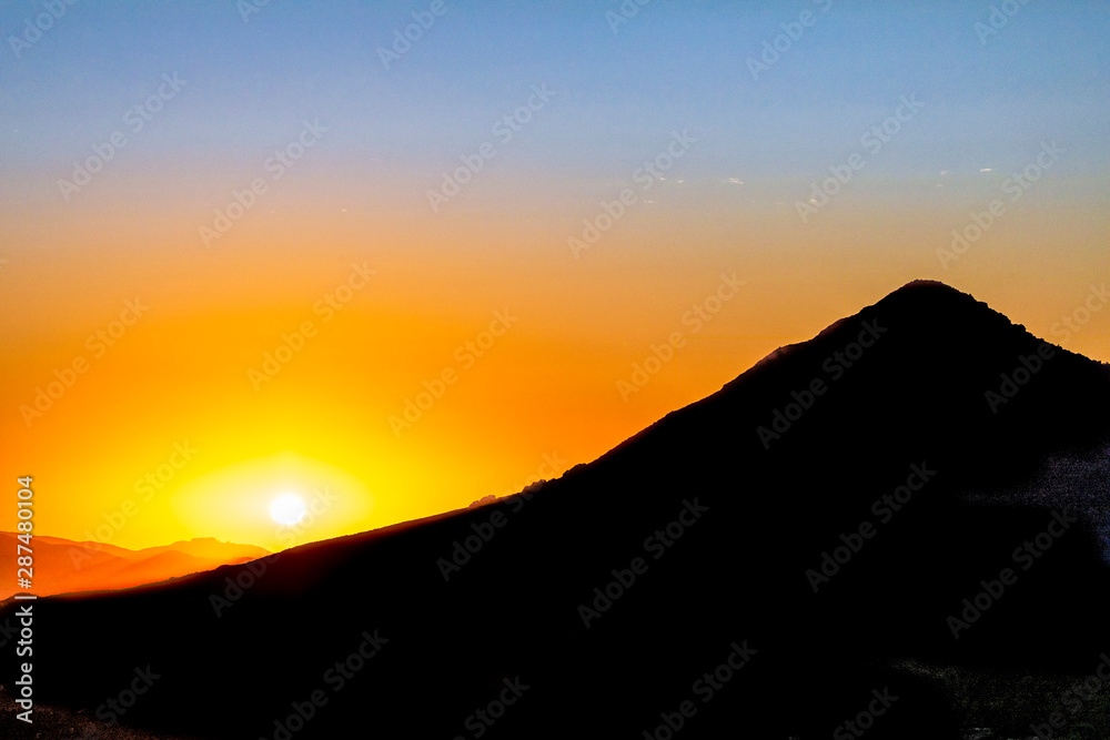 Hill Silhouetted at Sunset 