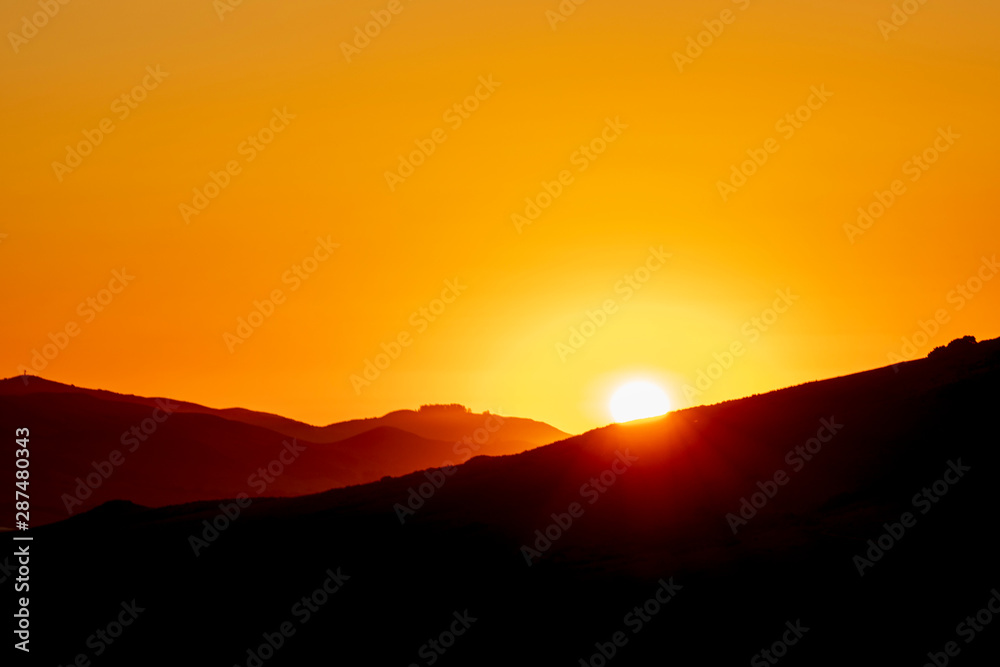 Silhouetted Horizon, Sunset, Sunburst glow