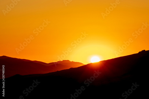 Silhouetted Horizon, Sunset, Sunburst glow