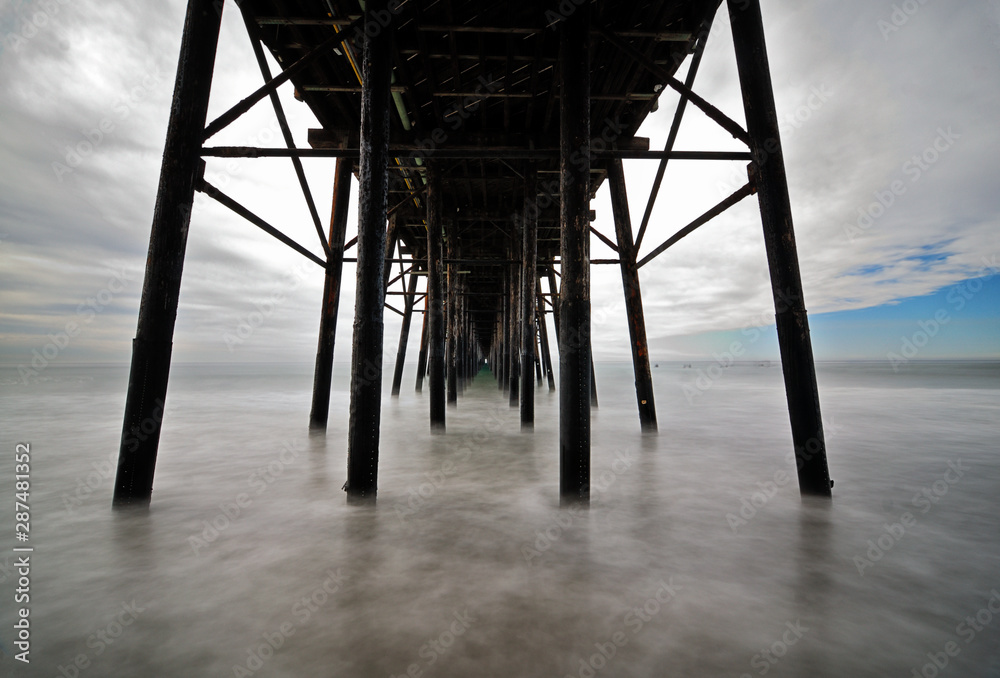 Under the Oceanside pier.