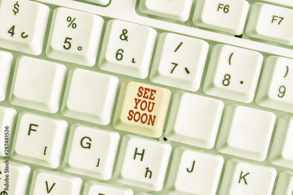 Conceptual hand writing showing See You Soon. Concept meaning used for saying goodbye to someone and going to meet again soon White pc keyboard with note paper above the white background Conceptual hand writing showing See You Soon. Concept meaning used for saying goodbye to someone and going to meet again soon White pc keyboard with note paper above the white background
