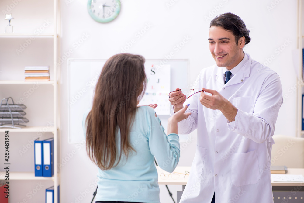 Young woman visiting male doctor oculist Young woman visiting male doctor oculist