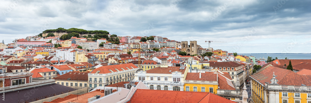 Panoramic view of Lisbon hill in Portugal, with São Jorge castle, Alfama district and Lisbon Cathedral.