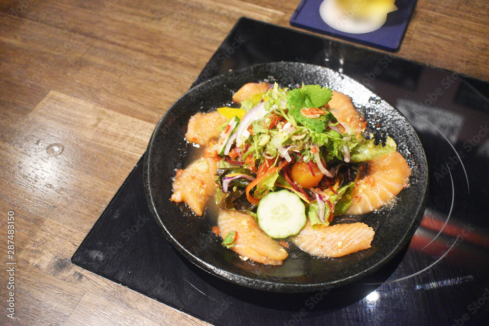 Spicy sashimi salmon salad with vegetables Japanese food style. Spicy sashimi salmon salad with vegetables Japanese food style.