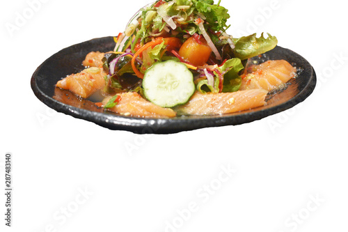 Spicy sashimi salmon salad with vegetables Japanese food style isolate white background