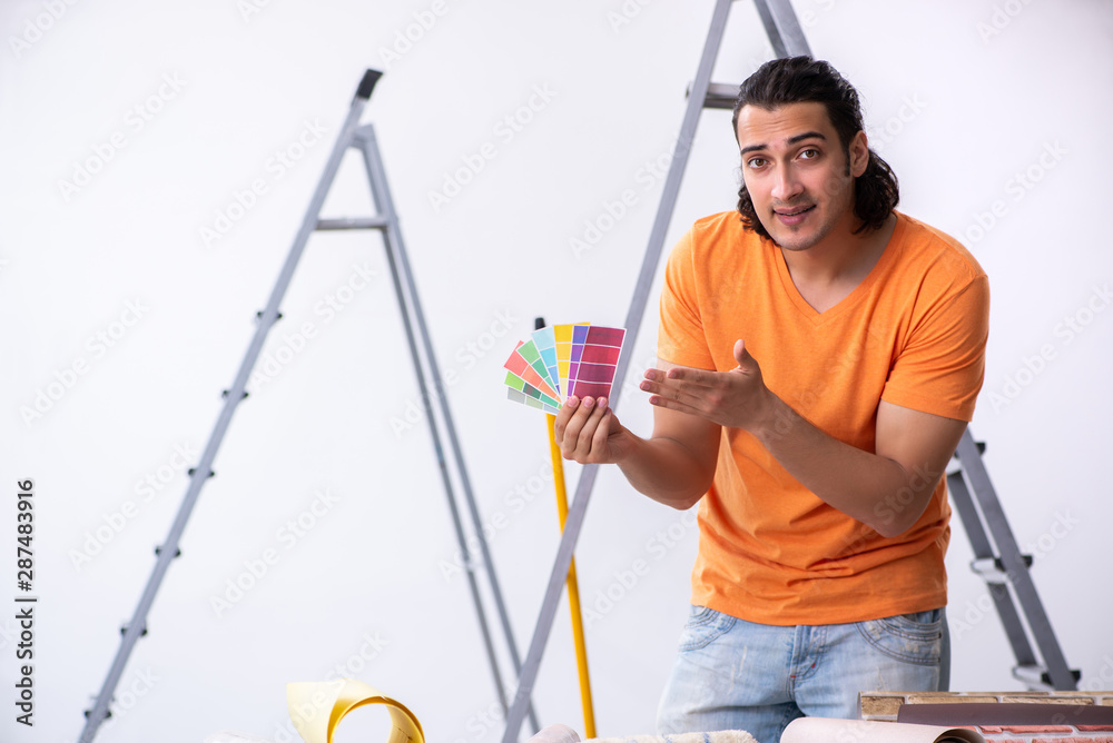 Young man contractor doing renovation at home Young man contractor doing renovation at home