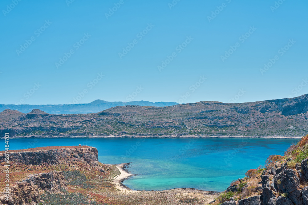                     Blue lagoon with rocks on a background in Crete, Greece. Copy space.          