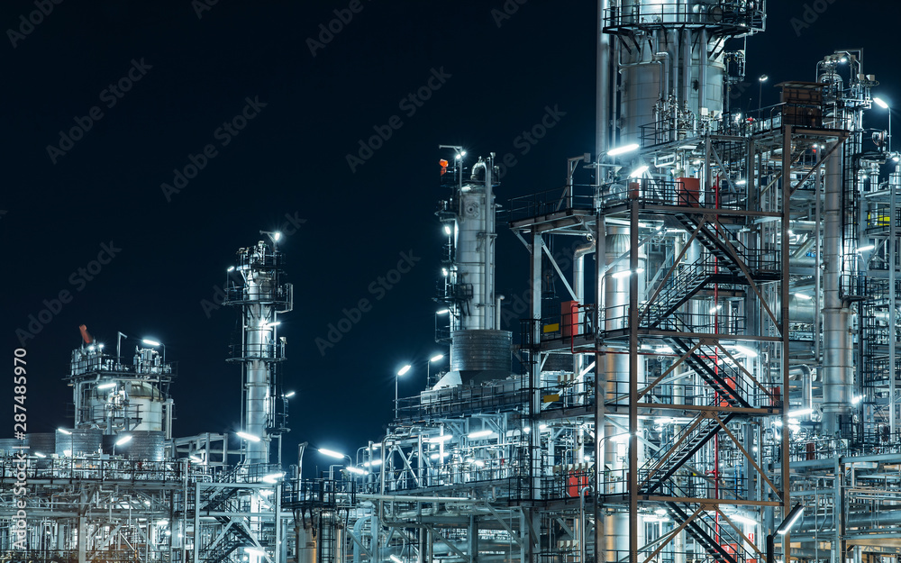 Industrial view oil and gas refinery,Detail of equipment oil pipeline steel at night background